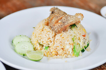stir fried rice or fried rice with fried fish topping , fish and rice