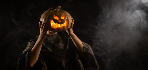 Pumpkin jack o lantern instead of a woman's head. Halloween