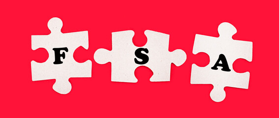 Three white jigsaw puzzles with the text FSA Flexible Spending Account on a bright red background.