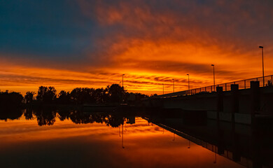 Beautiful sunset with reflections near Plattling, Isar, Bavaria, Germany