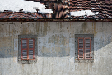 Dilapidated facade of classic French chalet building