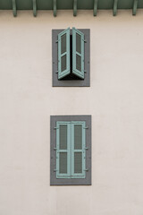 Classic Chamonix apartment building facade with shuttered windows