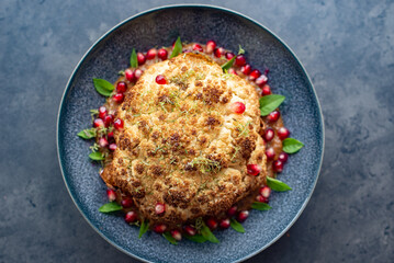 whole roasted oven baked cauliflower with spicy herbs 