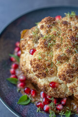 whole roasted oven baked cauliflower with spicy herbs 