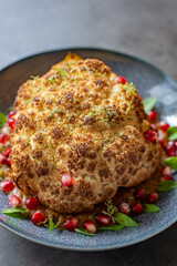 whole roasted oven baked cauliflower with spicy herbs 