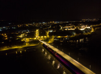 The capital of Vojvodina, Novi sad at night. The bridge on the Danube river. Aerial photography.