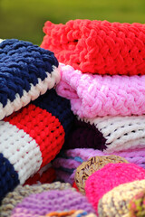 Heap of colorful trendy knitted clothing