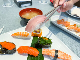 Sushi set of nigiri and maki rolls served on dish. Japanese food.