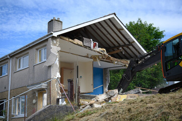 Fototapeta na wymiar Property Demolition. A row of houses in united kingdom being demolished for land regeneration