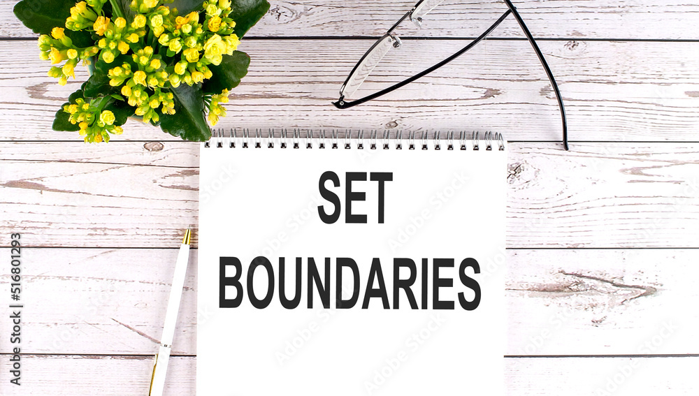 Poster SET BOUNDARIES text concept write on notebook on wooden background