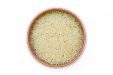 White steamed rice in a clay bowl. Close-up