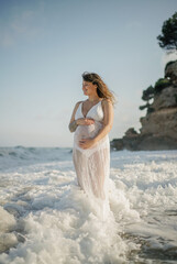 Pregnant woman on the seaside