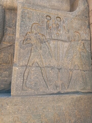 Detail of the hieroglyphs carved on the stone of an ancient wall in Egypt