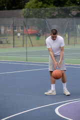 A Nineteen Year Old Teenage Boy Playing Basketball