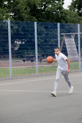 A Nineteen Year Old Teenage Boy Playing Basketball