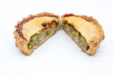 typical Majorcan “ empanada ” with meat, pea and sobrassada on white background