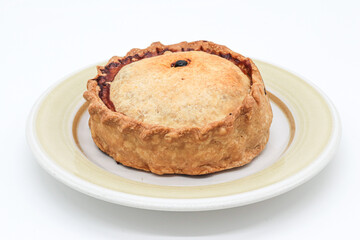 typical Majorcan “ empanada ” with meat, pea and sobrassada on white background