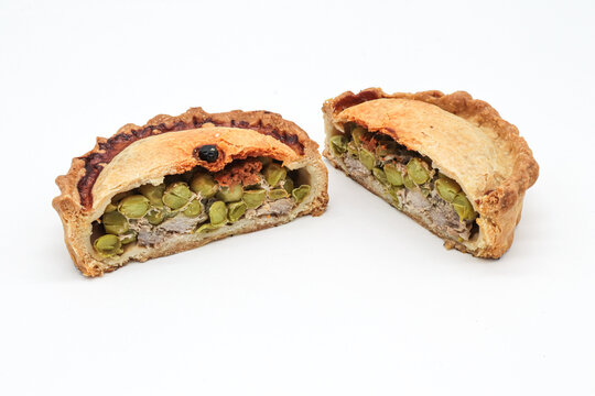 typical Majorcan &ldquo; empanada &rdquo; with meat, pea and sobrassada