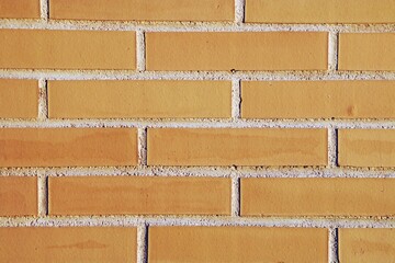 Primer plano de una pared nueva. Fondo rojo-naranja de una áspera pared de ladrillos y cemento.