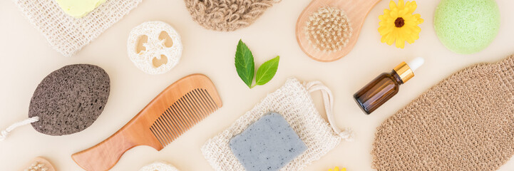 Banner with self-care products, natural bath accessories for body and skin care over light background. Zero waste and eco living concept. Flat lay style. Long web format