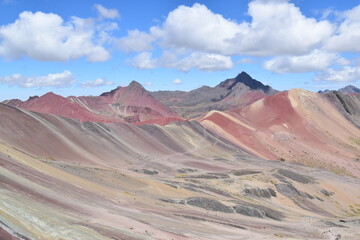 Fototapeta na wymiar The Rainbow Mountain Vinicunca (Montana de siete colores) and the valleys and landscapes around it in Peru