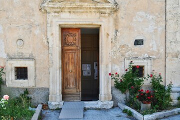 Fototapeta na wymiar The door of a small church in Campo di Giove, a medieval village in the Abruzzo region of Italy.