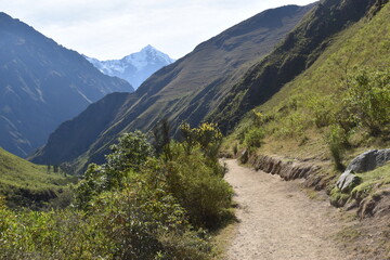 Fototapeta na wymiar The dramatic landscapes of the Andes Mountains and cloud forests around the hiking path on the Inca Trail in Peru