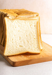Stack of slice bread isolated on bright background with negative space
