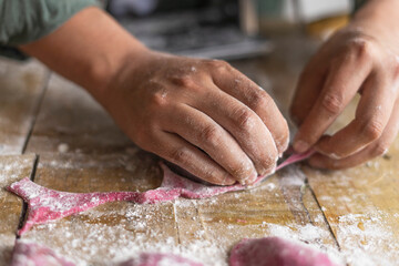 hands of the child baking cookies