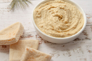 Creamy classic hummus with pita slices