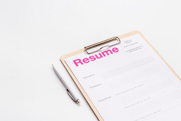 Searhing for a new job. Resume application form on office table