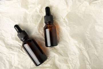 Essential oil on beige texture background. Spa concept. RELAX. Care aroma oil. Copy space. Place for text.