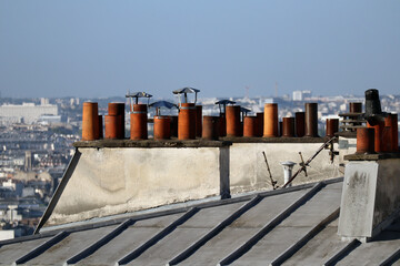 Close-up of chimneys on the rooftops of Paris