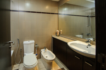 Cozy studio apartment design with bedroom and living space. Hotel room panoramic window, double bed, sofa and coffee table. Urban apartment concept