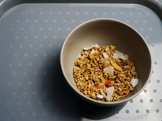 Granola cereal for breakfast in a bowl medium shot