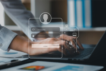 An individual is typing on a laptop keyboard showing a hologram interface to a member login, a...