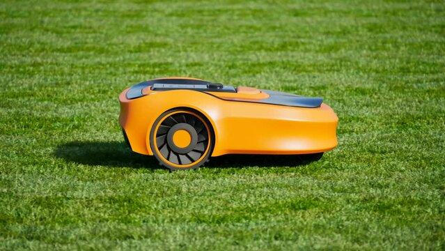 A lawn robot mows the yard. Wireless robotic lawn mower trims the grass.