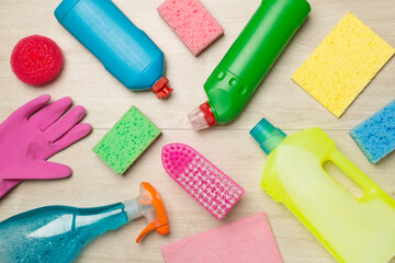 Many different house cleaning products on wooden background, top view