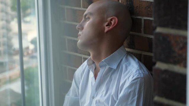 Sad bald man with cancer or hiv infection, close-up