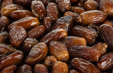 The surface texture of selected dried dates. Natural oriental sweets.