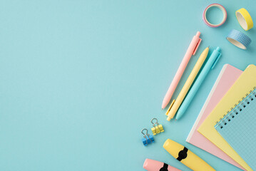 Back to school concept. Top view photo of school supplies notepads pens adhesive tape binder clips...