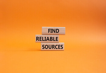 Find reliable sources symbol. Wooden blocks with words Find reliable sources. Beautiful orange background. Business and Find reliable sources concept. Copy space.
