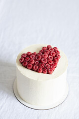Valentine's Day cake decorated with raspberry heart.
