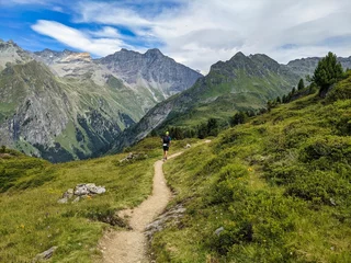 Fotobehang trail running in the valais alps. Beautiful hiking trails in Switzerland. Cabane Brunet. Swiss Alps. trailrunning. High quality photo © SimonMichael
