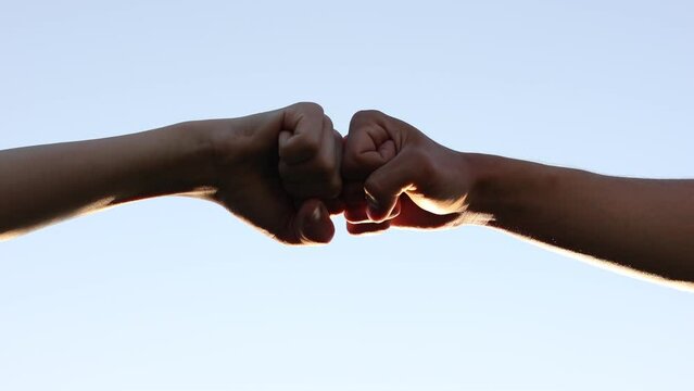 teamwork concept. fist to fist commit solidarity a respect and brotherhood gesture. lifestyle business team hands fists close-up. partnership friendship teamwork.