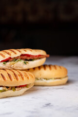 fried panini with ham on a dark backgroun