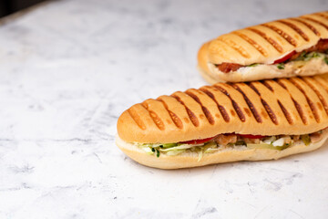 panini with filling. three panini on a white background