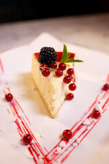 tender cheesecake new york with berries. Served in a restaurant