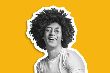 Cool african american guy with bushy hair over yellow background