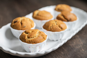 Appetizing muffins on beautiful plate